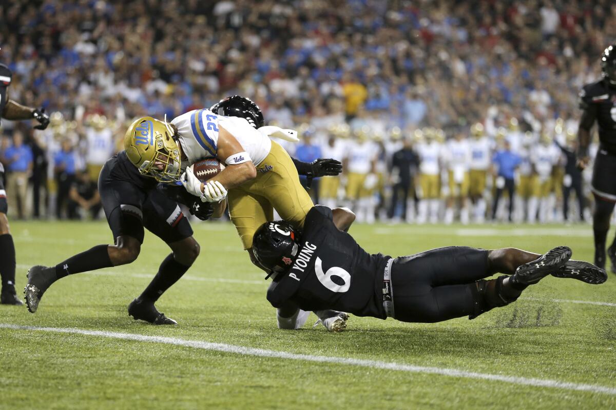 UCLA wide receiver Chase Cota scores a touchdown against Cincinnati during the second half of the Bruins' loss Thursday.