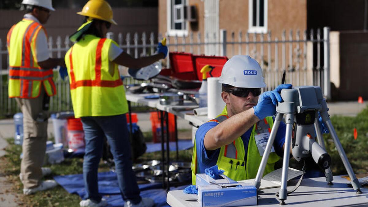 Soil taken from a yard in Commerce near the now-shuttered Exide battery plant is tested in February by a team from the L.A. County Health Department.