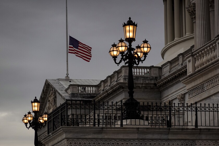 The flag flies at half-staff at the U.S. Capitol in Washington, Wednesday evening, Dec. 29, 2001, to honor longtime Senate Majority Leader Harry Reid of Nevada who died Tuesday. (AP Photo/J. Scott Applewhite)