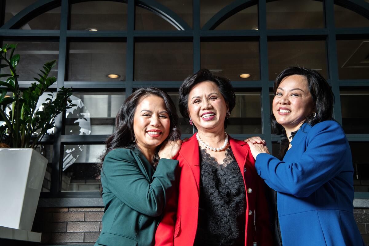 Diane Dang, center, and daughters Chau Haller, left, and Lisa Vo in one of their family's restaurants, Brodard.