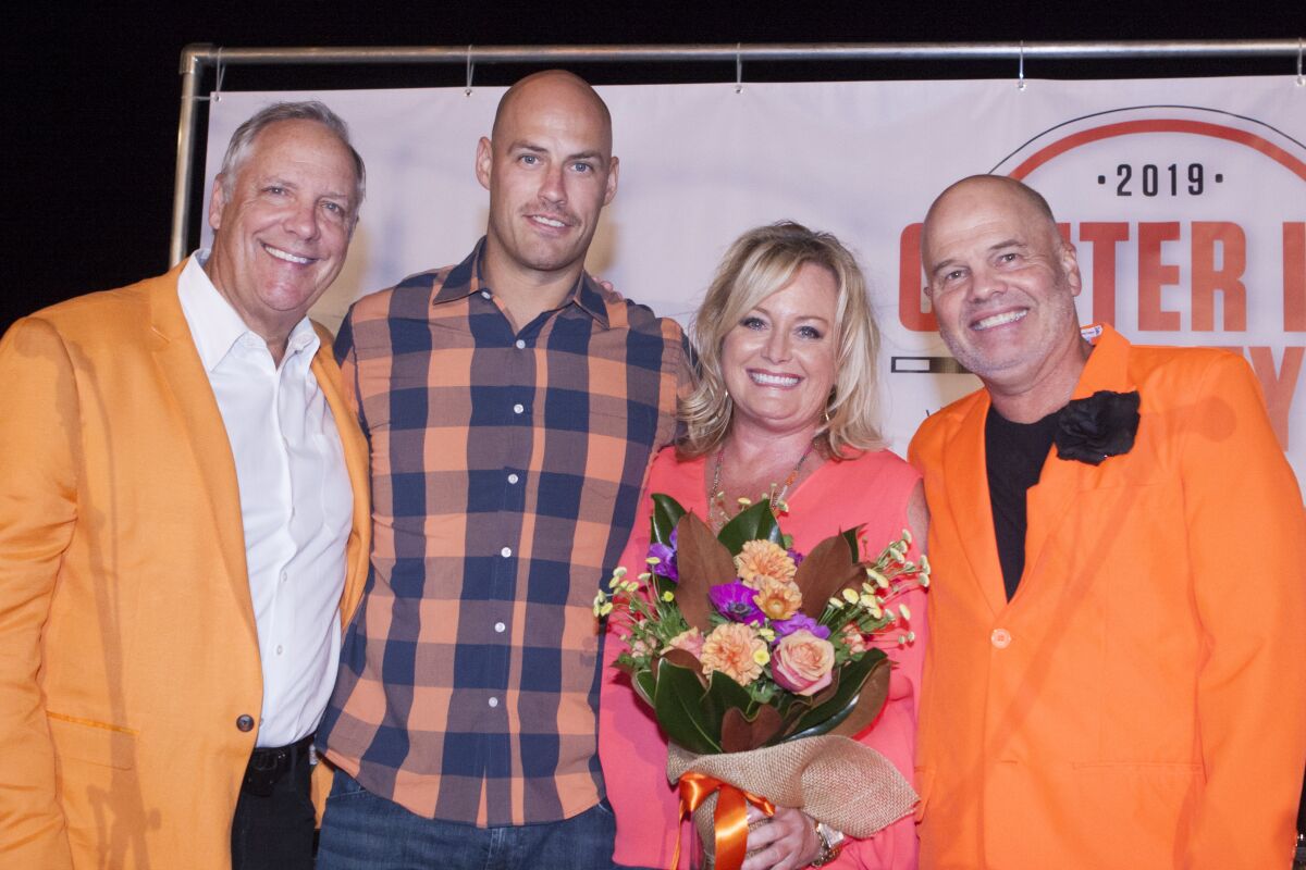 Anaheim Ducks Chief Executive Tim Ryan stands with Ducks player Ryan Getzlaf, event chairwoman Kimberly Kirksey and Chris Simonsen. They attended an event that benefited the Orangewood Foundation.
