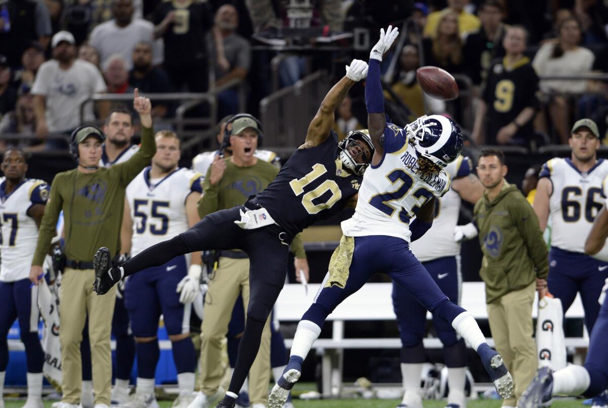 Los Angeles Rams defensive back Nickell Robey-Coleman (23) breaks up a pass intended for New Orleans Saints wide receiver Tre'Quan Smith (10) in the second half of an NFL football game in New Orleans, Sunday, Nov. 4, 2018.