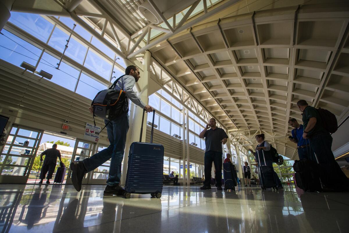 Travelers at Ontario International Airport in Ontario. 