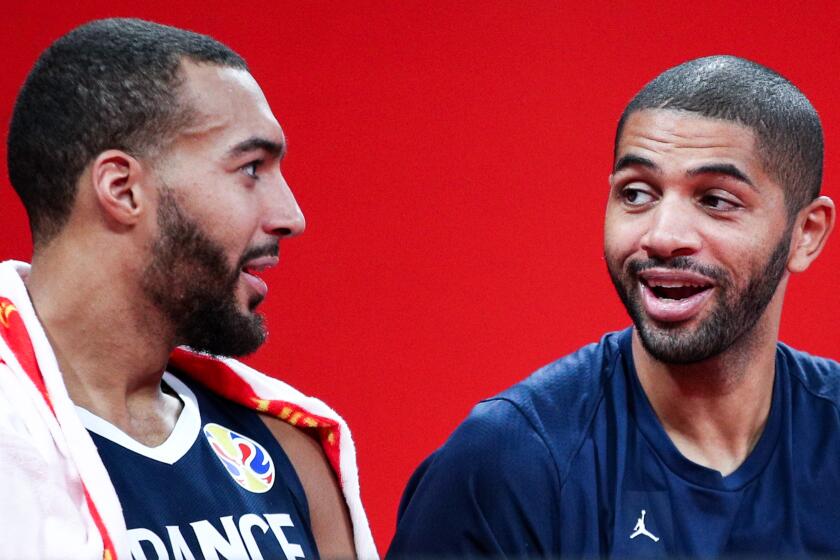 SHENZHEN, CHINA - SEPTEMBER 03: #5 Nicolas Batum(R), #27 Rudy Gobert and #2 Amath M'baye(L) of the France National Team