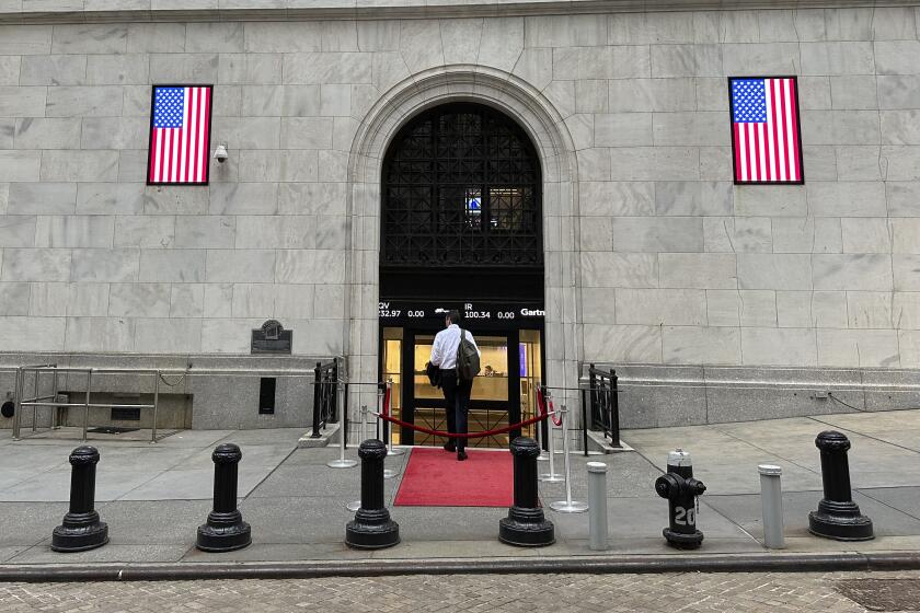 A man enters the New York Stock Exchange on Wednesday, July 17, 2024, in New York. Global stocks have mostly fallen, with shares in London declining after data showed the inflation rate remained steady at the Bank of England's 2% target in June. (AP Photo/Peter Morgan)