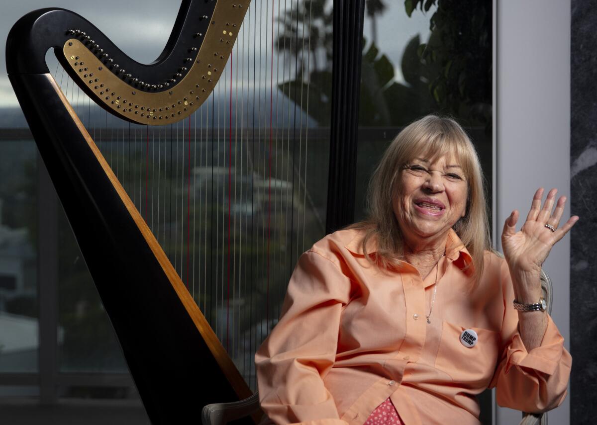 Musician Corky Hale, a renowned vocalist, jazz pianist and harpist, has long been one of the country’s staunchest and most generous supporters of abortion rights. She's shown here in front of her Los Angeles home.