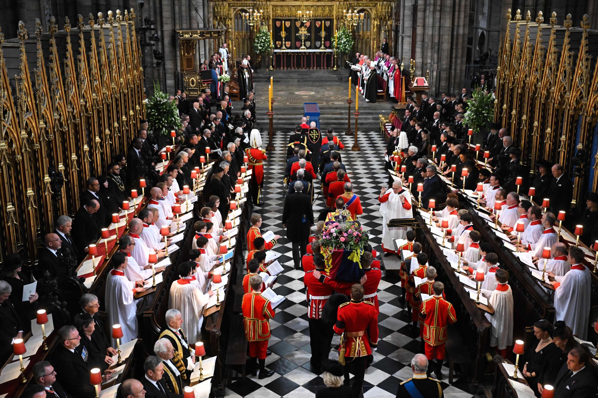 The coffin of Queen Elizabeth II arrives for her state funeral on Monday at Westminster Abbey in London.