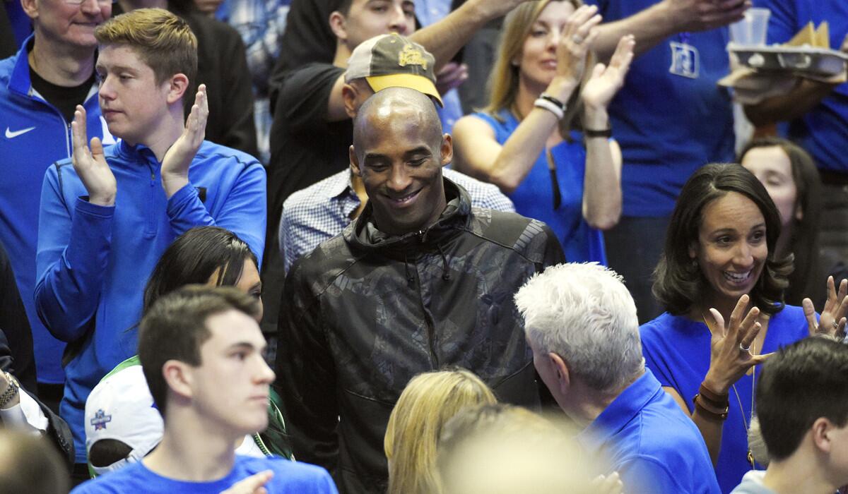 Lakers guard Kobe Bryant arrives for a college basketball game between Oregon and Duke in the regional semifinals of the NCAA Tournament on Thursday.