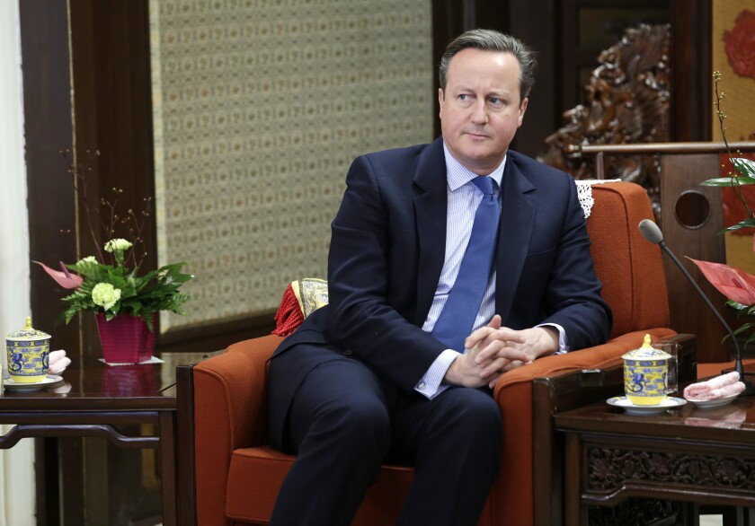 FILE - In this Tuesday, Nov. 27, 2018 file photo, former British Prime Minister David Cameron meets China's Premier Li Keqiang at Zhongnanhai leadership compound, in Beijing, China. Cameron says he never suspected that a financial services company that he lobbied for would go under, threatening thousands of jobs at a steel firm it helped finance. Cameron was summoned Thursday, May 13, 2021 to answer lawmakers’ questions about his efforts to win government funds for Greensill Capital, which collapsed in March(Jason Lee/Pool Photo via AP, file)