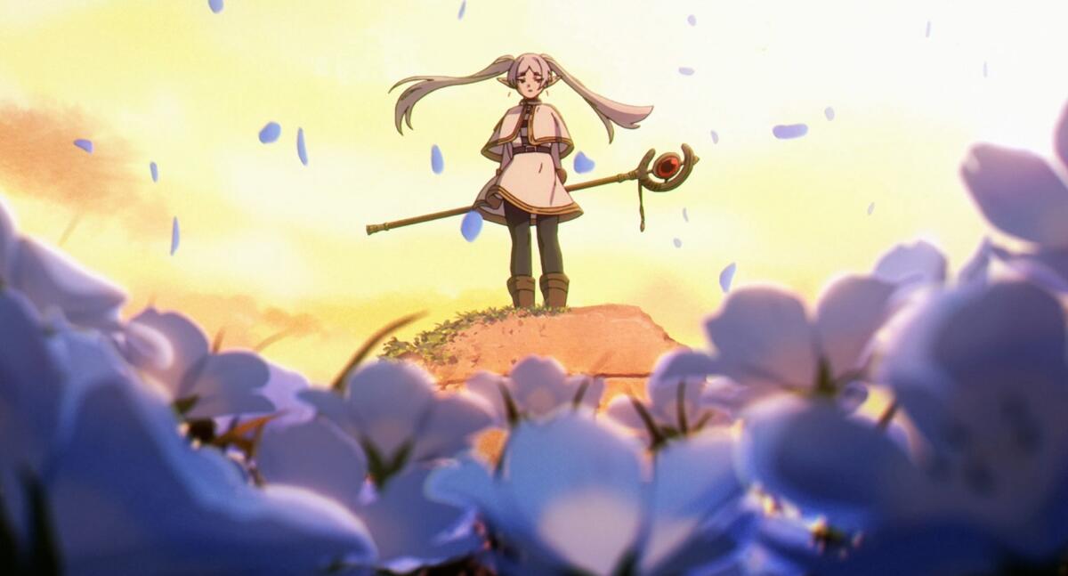 An animated image of a girl warrior holding a scepter while standing atop a hill surrounded by blue purple flowers.