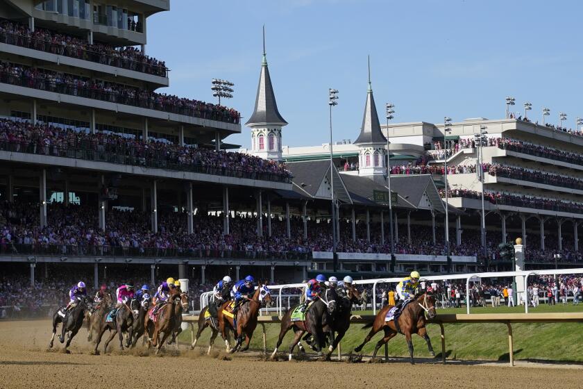 Horses run the 149th running of the Kentucky Oaks horse race at Churchill Downs Friday, May 5, 2023, in Louisville, Ky. (AP Photo/Julio Cortez)