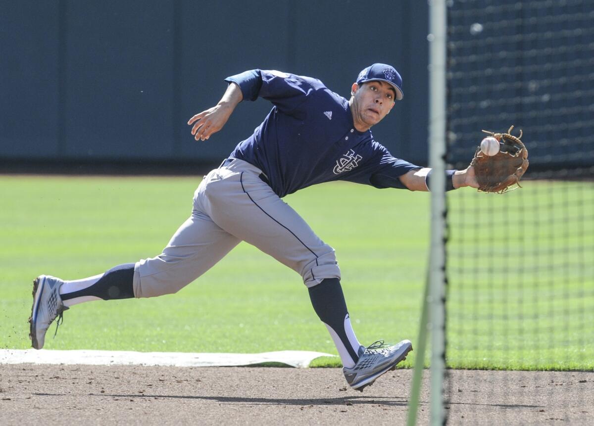UC Irvine's Chris Rabago fields a ball during team practice Friday ahead of the Anteaters' College World Series opener Saturday against Texas.