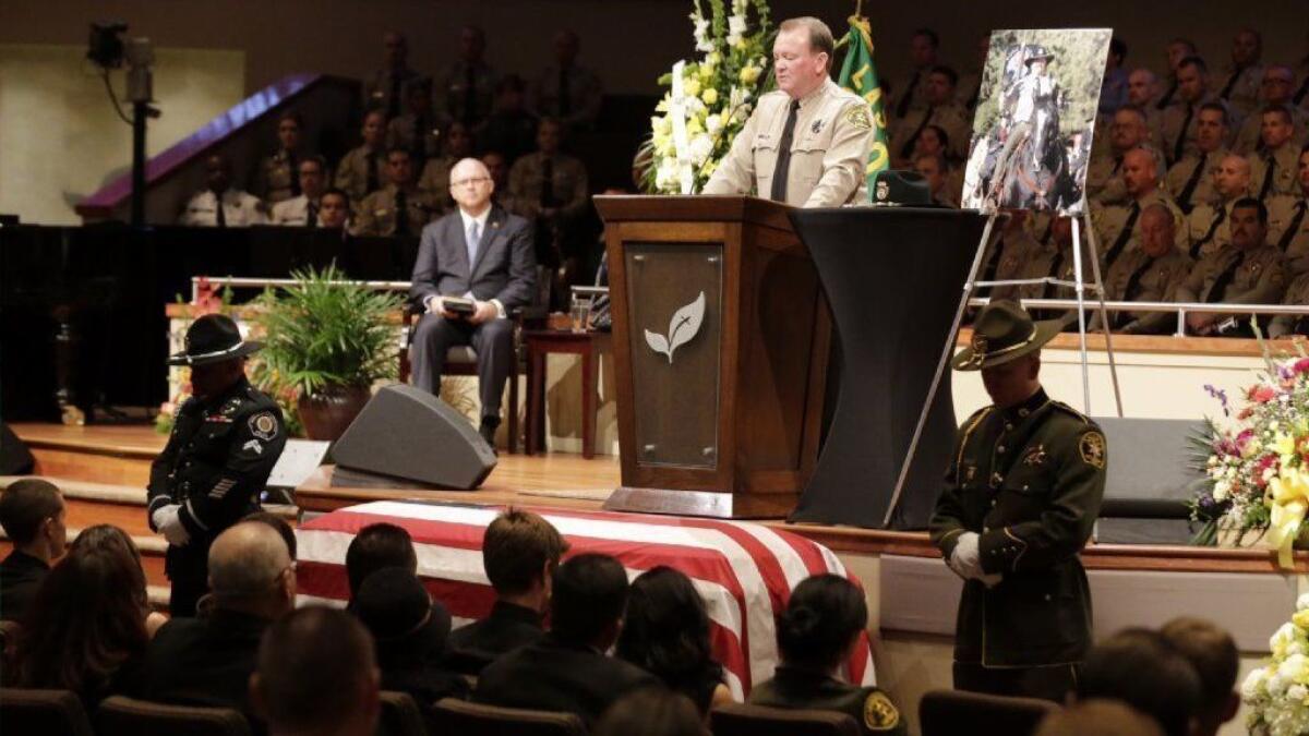 Los Angeles County Sheriff Jim McDonnell speaks as thousands gathered for the 2016 funeral of slain Los Angeles County Sheriff's Sgt. Steve Owen in Lancaster.