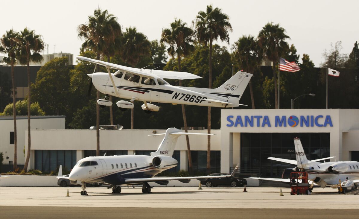 A private plane takes off from Santa Monica Municipal Airport.