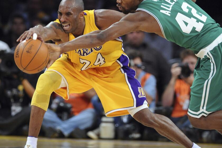 Kobe Bryant battles Boston's Tony Allen for a loose ball in the fourth quarter of Game 6 of the NBA Finals on June 15, 2010.