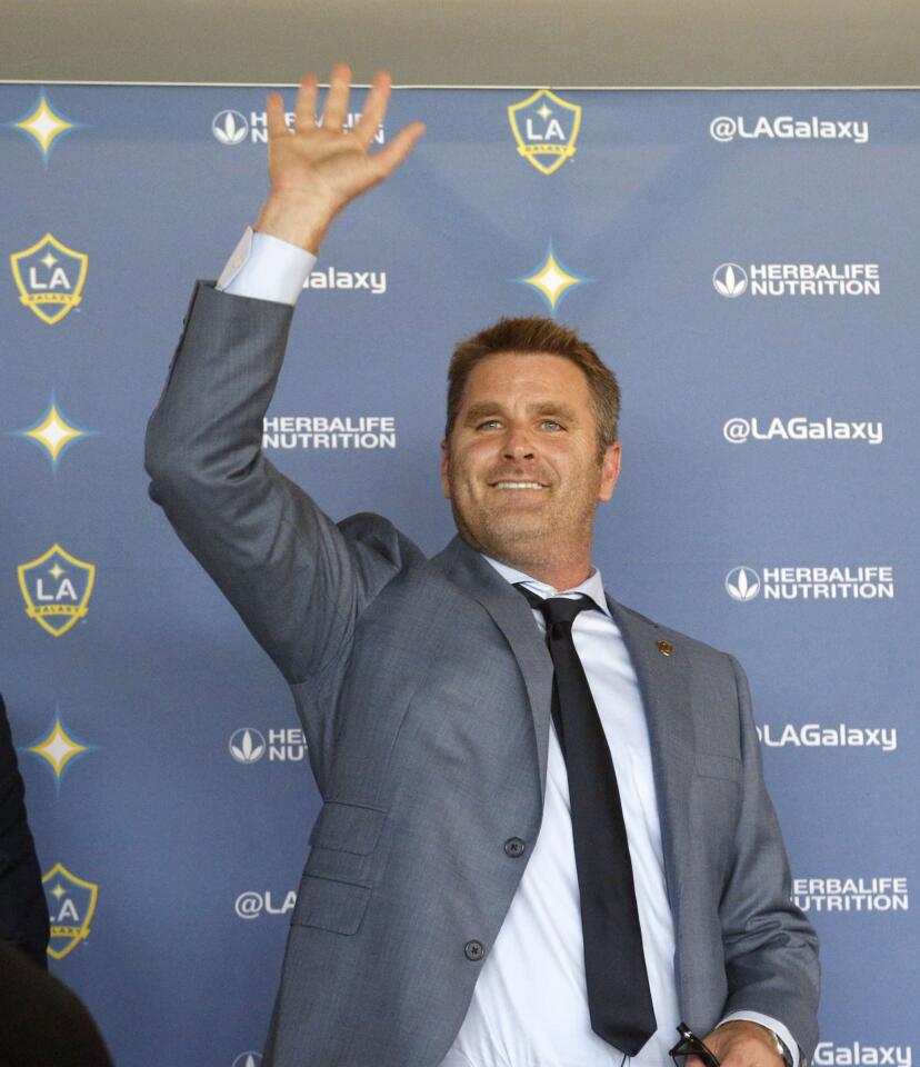 Curt Onalfo smiles as he is introduced as the new head coach of the Los Angeles Galaxy soccer team at news conference in Carson, Calif., Tuesday, Dec. 13, 2016. Onalfo replaces Bruce Arena, who returned to the U.S. national team after guiding the Los Angeles Galaxy to three MLS Cup titles. (AP Photo/Nick Ut)