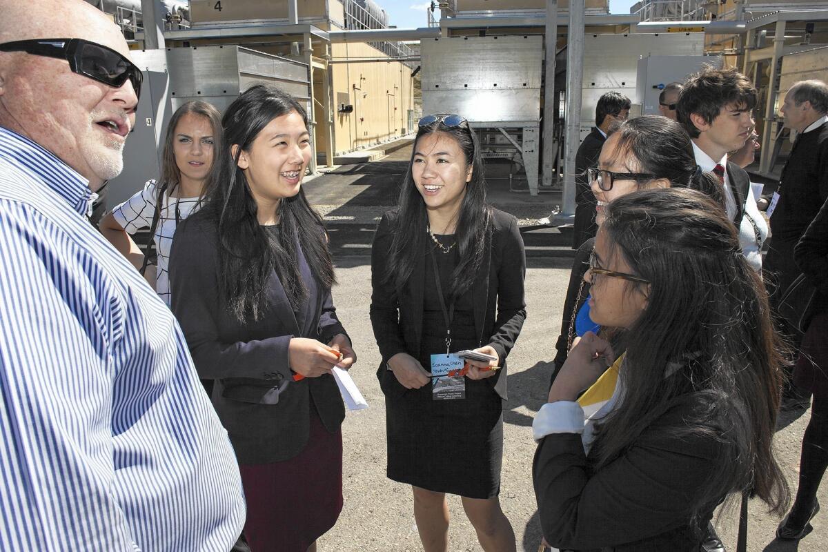 Woodbridge High School senior Joanna Chen, center, and other members of the YMCA Youth and Government program are led on a tour of the Bowerman Power Project gas-to-electricity facility by plant manager Brian Kelley, left, on Tuesday at Irvine's Bowerman Landfill.