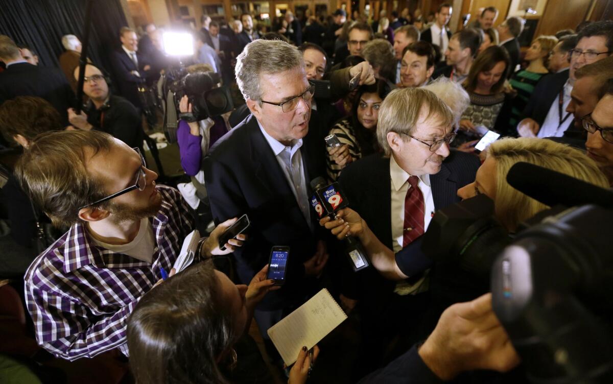 Former Florida Gov. Jeb Bush speaks to reporters during a reception for Rep. David Young (R-Iowa) in Urbandale, Iowa.