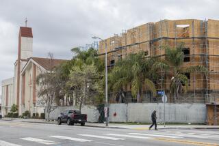 LOS ANGELES, CA- APRIL 04: Affordable housing is being built on the parking lot of Bethel AME Church in Los Angeles, CA on Thursday, April 4, 2024. Logos Faith Development LLC is building the approximately 15,000 sq.-ft., five-story construction that will have 53 one-bedroom apartments and 96 parking spaces which includes enough spaces for church attendees. The project is scheduled to open around summer. (Myung J. Chun / Los Angeles Times)