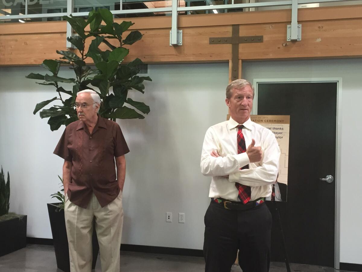 California Democratic Party Chairman John Burton, left, and environmentalist Tom Steyer speak at an event Thursday marking the LEED Gold certification of the party's headquarters.