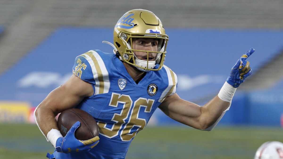 UCLA wide receiver Ethan Fernea (36) runs the ball during the first half.