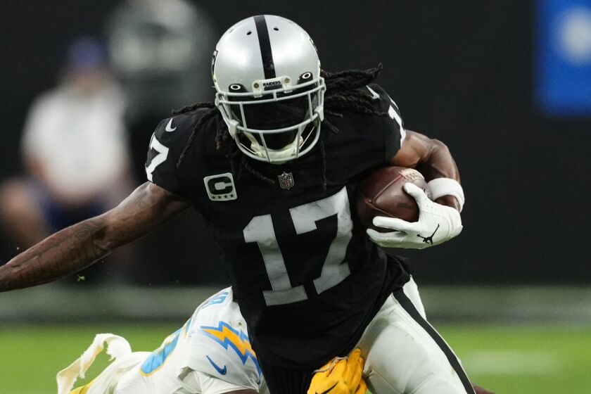 Las Vegas Raiders wide receiver Davante Adams (17) carries on a pass reception against Los Angeles Chargers.