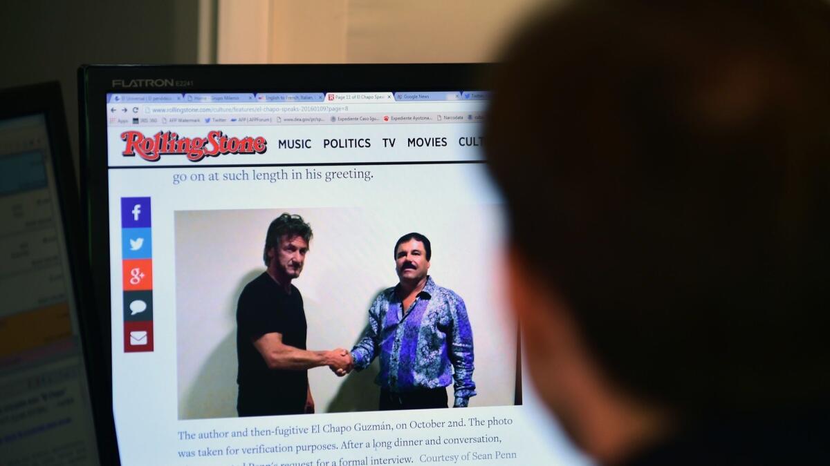 A man reads an article about drug lord Joaquin "El Chapo" Guzman, who was interviewed by actor Sean Penn for Rolling Stone magazine. Portions of that interview were played at Guzman's trial Tuesday.