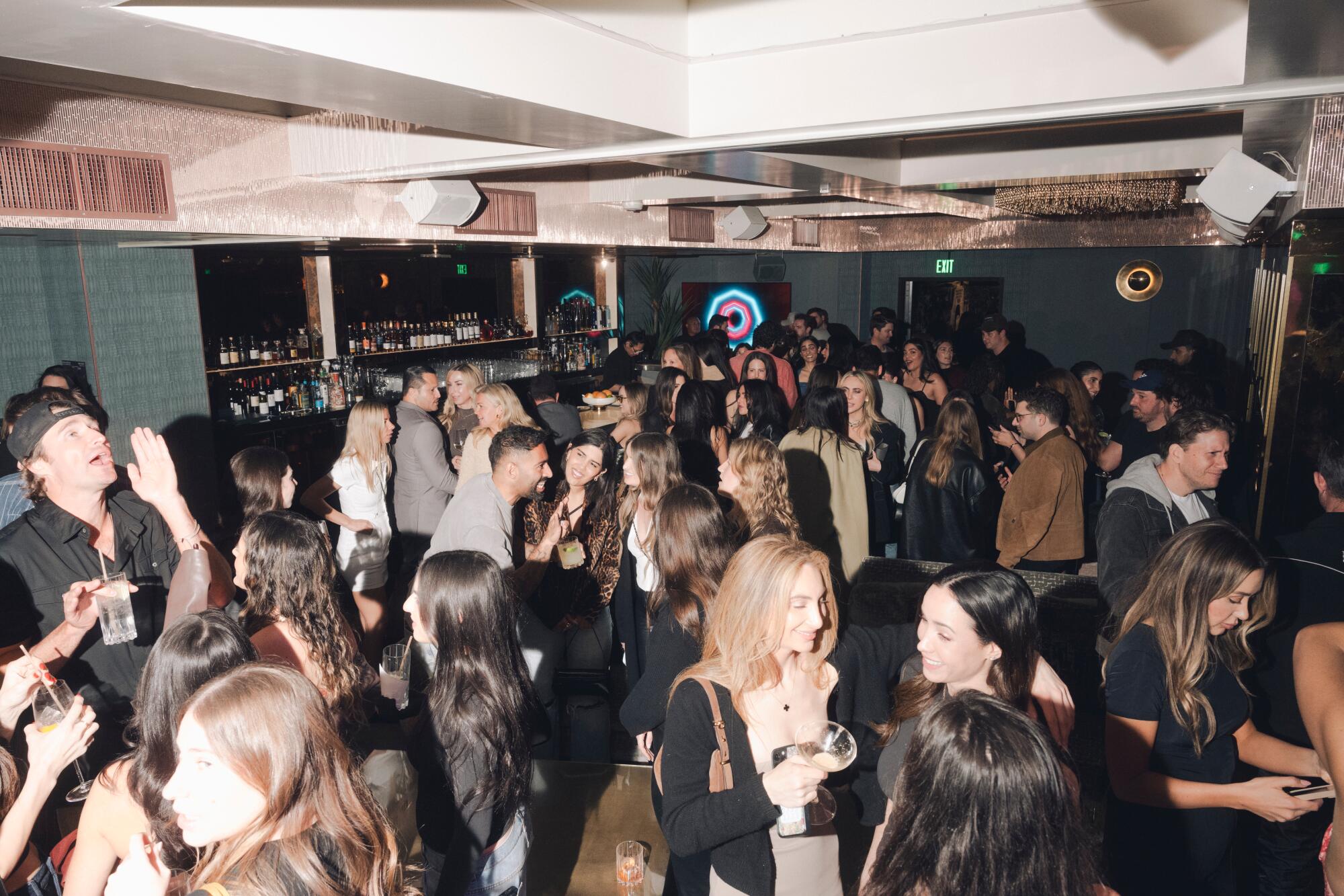 After playing Rummikub for an hour, attendees climbed the stairs to enjoy a live DJ and exclusive cocktails.