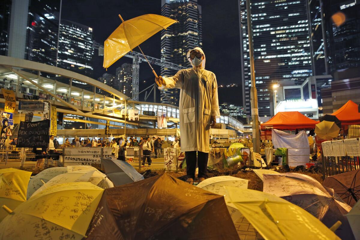 A protester holds an umbrella during a 2014 rally near Hong Kong's government buildings.