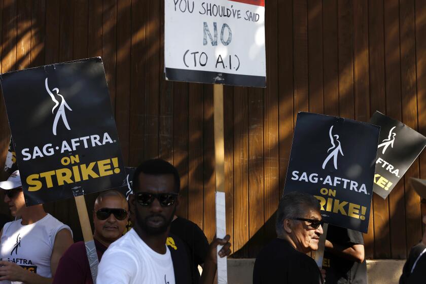 BURBANK-CA-AUGUST 22, 2023: SAG-AFTRA and WGA join forces with the AFL-CIO and its affiliates from across the nation and across industries for a national day of solidarity rally outside of Disney Studios in Burbank on August 22, 2023, fighting for fair contracts, better compensation, safe working conditions and protections from encroaching technology. (Christina House / Los Angeles Times)