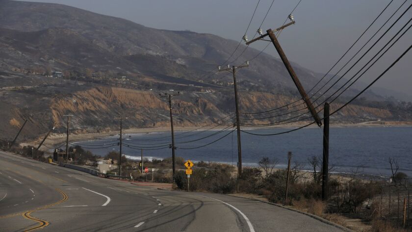 Broken electrical poles along Pacific Coast Highway can be seen following the Woolsey fire in Malibu.