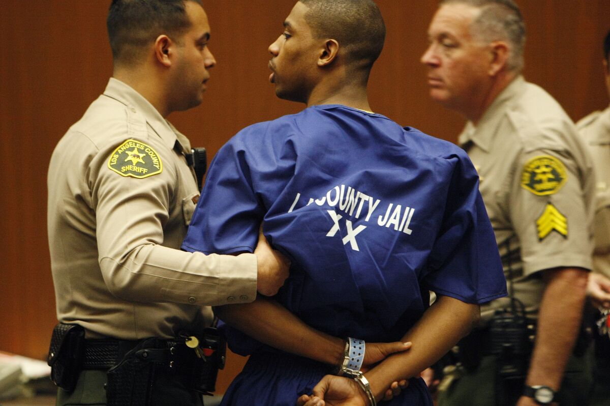 Brandon Spencer is escorted by L.A. County sheriff's deputies from a Los Angeles Superior County courtroom