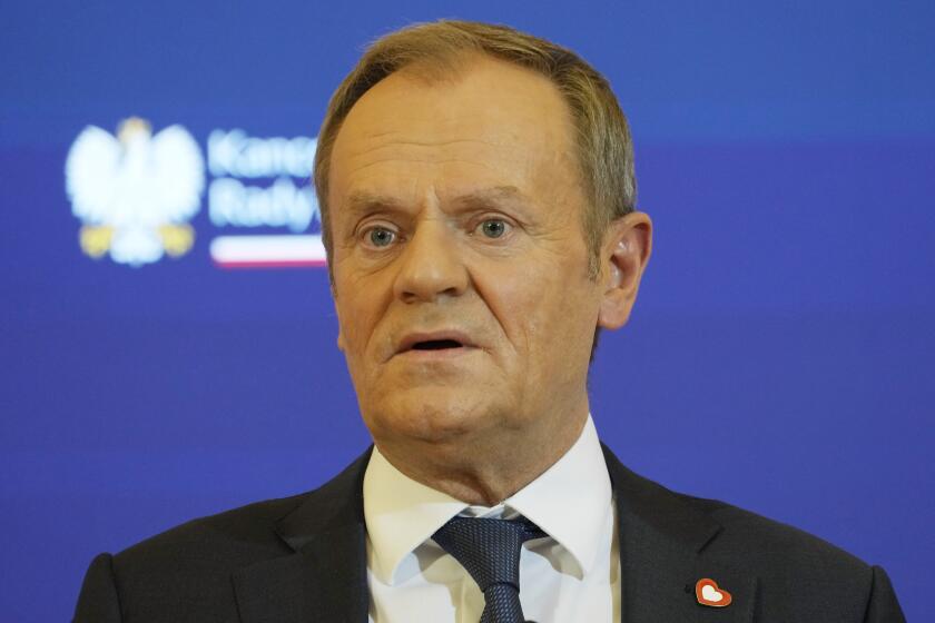 Poland's new Prime Minister Donald Tusk tells during a news conference that his pro-European Union government is urgently preparing a new spending bill to secure raises for teachers and re-dedicate some 3 billion zlotys ($762 million), originally meant for state media, to children's health, after President Andrzej Duda, allied with the opposition party, vetoed the previous bill that earmarked funds for state media, in Warsaw, Poland, Wednesday Dec. 27, 2023. (AP Photo/Czarek Sokolowski)