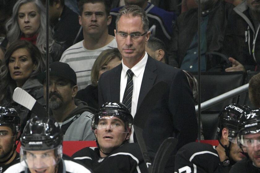 Los Angeles Kings head coach John Stevens looks on from the bench during a preseason NHL hockey game against the Anaheim Ducks, Saturday, Sept. 30, 2017, in Los Angeles. (AP Photo/Michael Owen Baker)