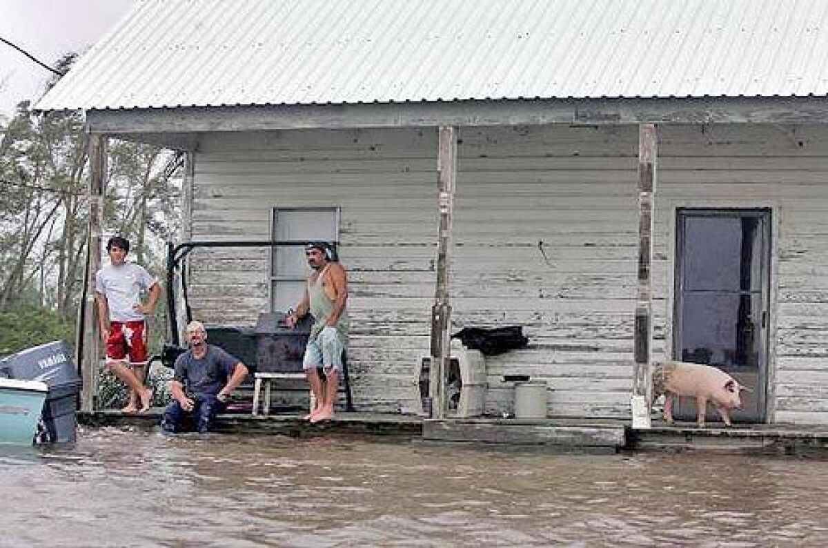 Some people in Erath, La., refused help even though floodwaters had risen to their porch.