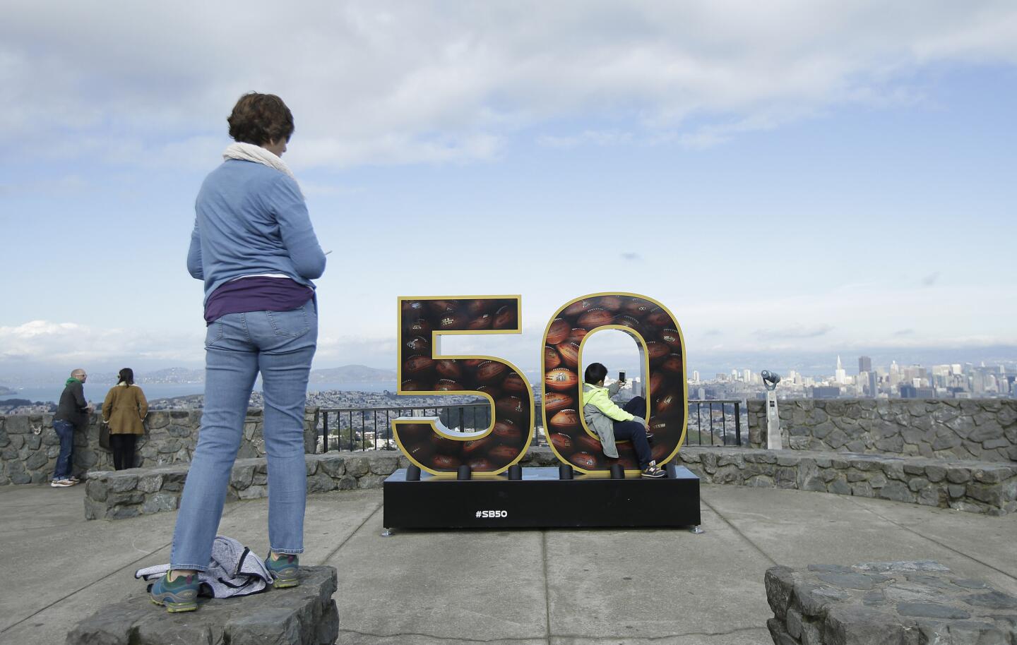 A Super Bowl 50 sign decorates a lookout point at Twin Peaks in San Francisco, Tuesday, Feb. 2, 2016. The Denver Broncos will play the Carolina Panthers in Super Bowl 50 Sunday, Feb. 7, 2016. (AP Photo/Jeff Chiu)