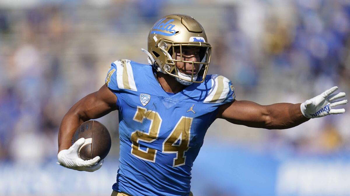 UCLA running back Zach Charbonnet runs with the ball against Utah on Oct. 8.