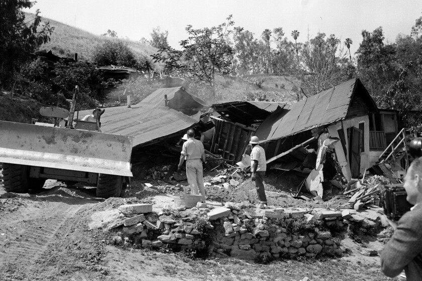 May 8, 1959: A bulldozer razes the Arechigas family home in Chavez Ravine immediately after family members, who had refused to leave, were forcibly removed. Homes were removed to make way for Dodger Stadium. Most homes in Chavez Ravine were removed in early 1950s for proposed development that fell through. Only a few homes were left in 1959 to be removed.