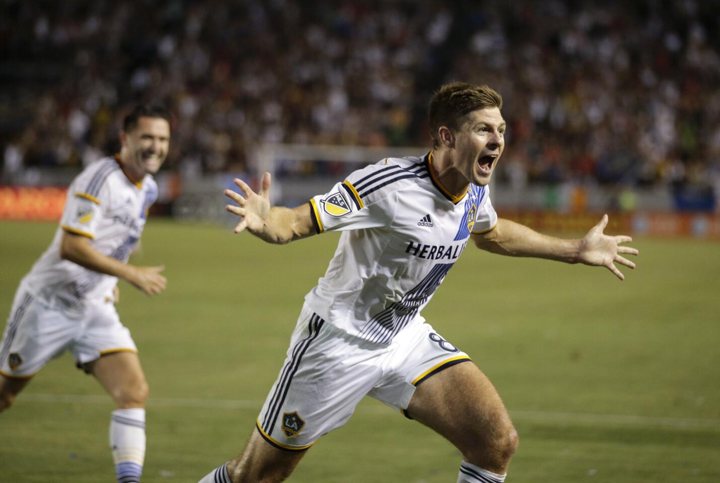 Los Angeles Galaxy's Steven Gerrard, of England, celebrates his first goal for the team, during the first half of an MLS soccer match against the San Jose Earthquakes, Friday, July 17, 2015, in Carson, Calif. (AP Photo/Jae C. Hong)