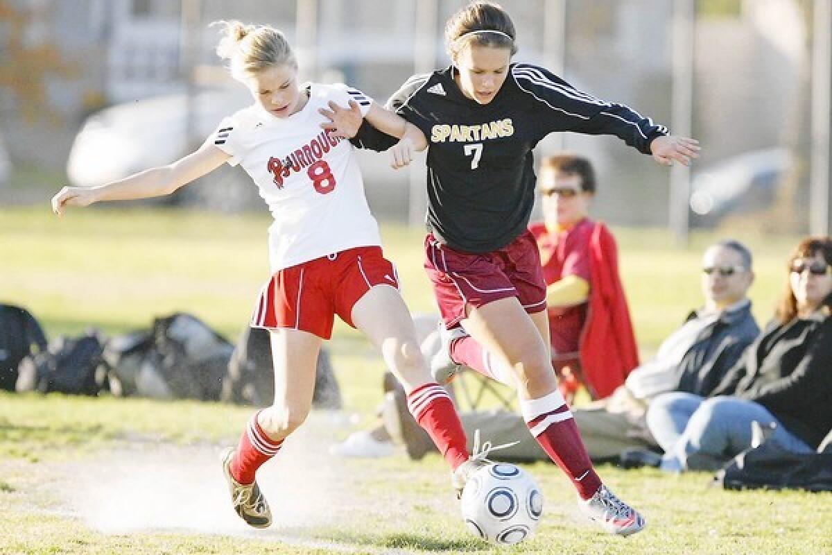 La Cañada High forward Megan Decker, right, helped lead the Legends FC 15-and-under girls' team to a National Championship on defense.