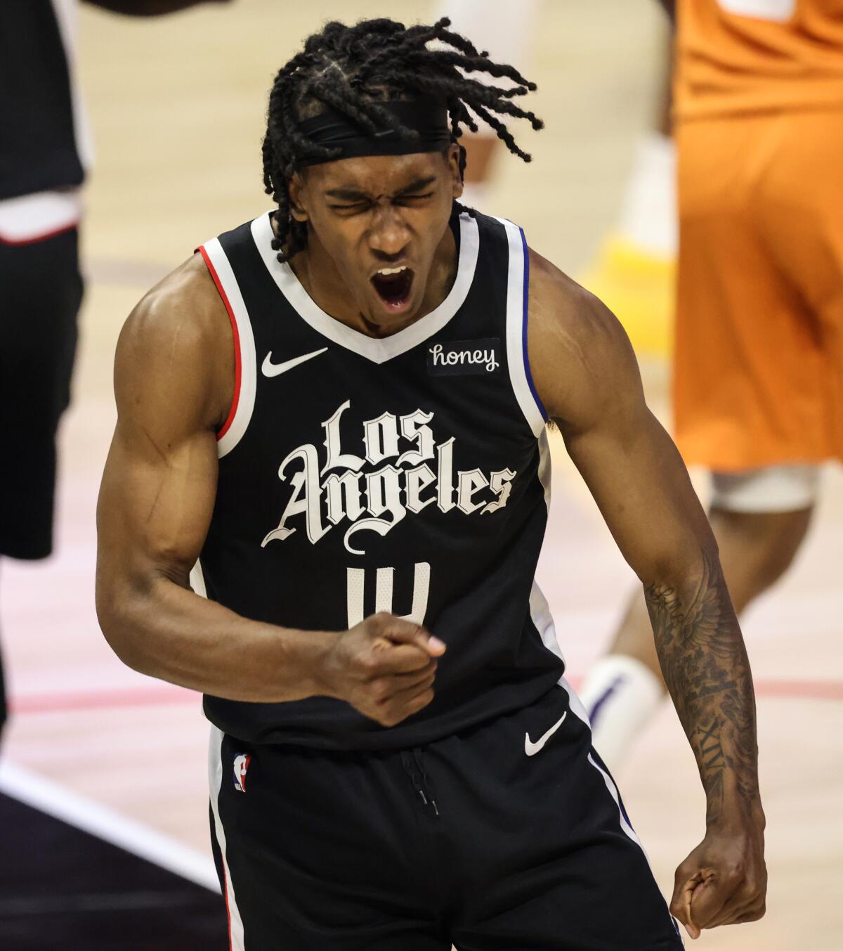 Clippers guard Terance Mann celebrates after scoring against the Suns during Game 3.