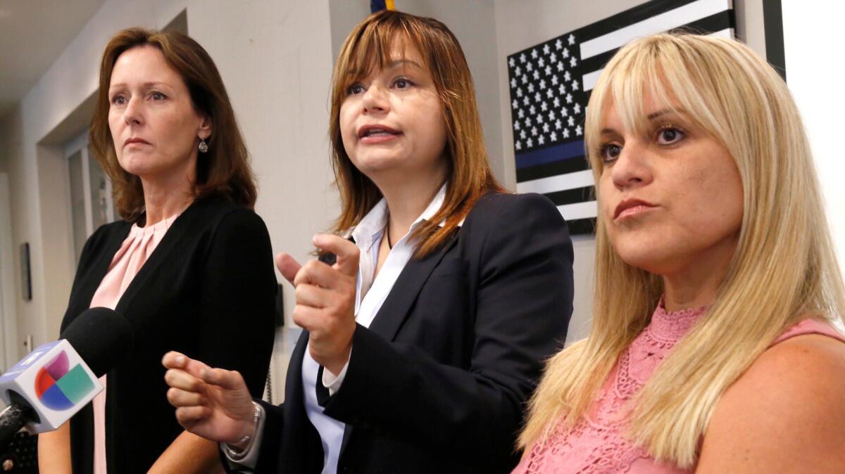 LAPD detective Ninette Toosbuy, center, with victims, Anna Arnette, left, and Courtney Rosenberg, right, address a press conference about the arrest of Eduardo Ramon Rodas Gaspar at the West Valley LAPD Station.