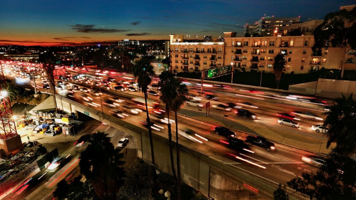 Vehicles burn fuel and emit greenhouse gases on the 110 Freeway. How strict should the regulations be?