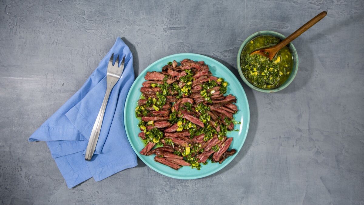 Skirt steak is seasoned simply with salt and pepper and served with a salsa made with fresh marjoram and lots of lime juice.