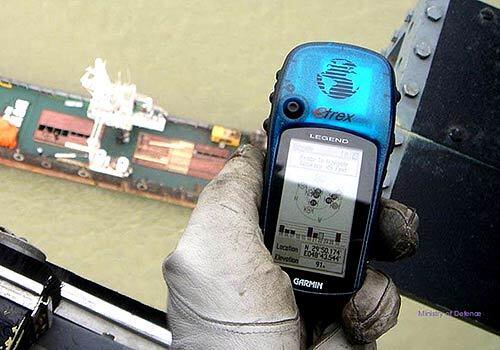 In this image made available by the Ministry of Defense in London a GPS device shows the location of the incident involving 15 Royal Navy personnel, as seen from a Royal Navy helicopter over the merchant vessel in the Shatt al-Arab waterway. Vice Admiral Charles Style says that the naval boats were 1.7 nautical miles inside Iraqi waters when Iran seized their 15 crew members.