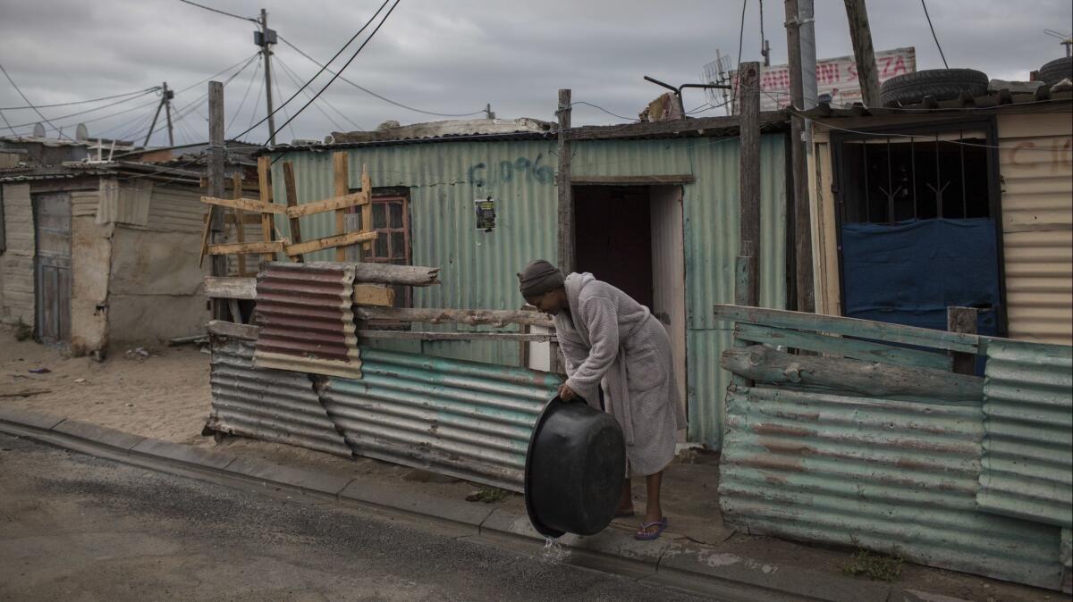Cape Town's wealthy cut water use by 80% while low-income earners slashed water use by 40%. Around a quarter of the population lives in informal settlements like this one, using only 4.5% of the city's water.