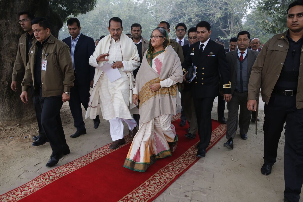 Bangladeshi Prime Minister Sheik Hasina arrives for a news conference in Dhaka on Monday, a day after her incumbent political coalition scored what commentators called a "hollow victory" in an election marred by opposition boycotts, strikes and economic sabotage.