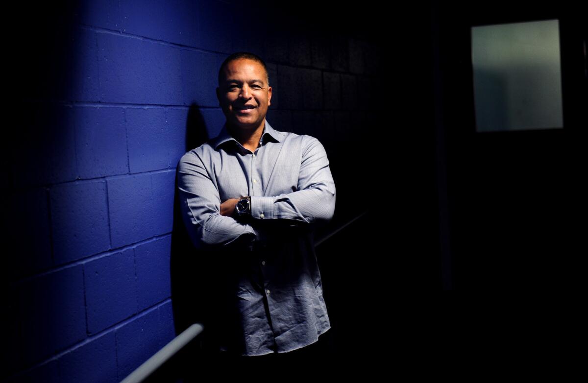 Dodgers new manager Dave Roberts stands near the clubhouse at Dodger Stadium before the start of the 2016 season.