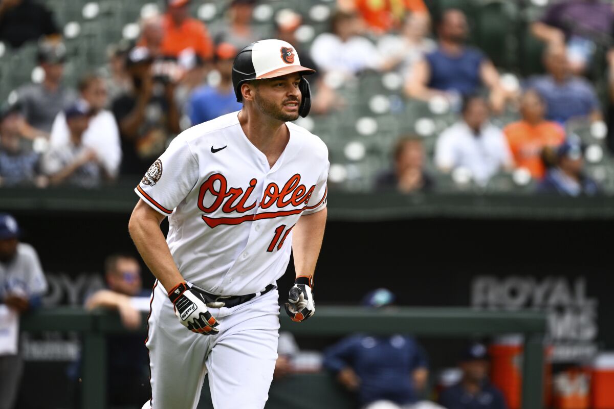Baltimore Orioles designated hitter Trey Mancini watches his inside the park home run hit against Tampa Bay Rays relief pitcher Shawn Armstrong during the eighth inning of a baseball game, Thursday, July 28, 2022, in Baltimore. (AP Photo/Terrance Williams)
