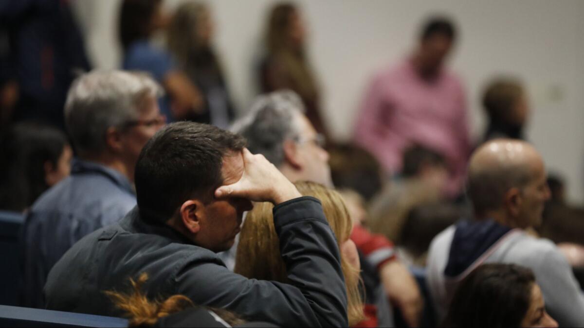 Parents, students, and community members assemble in a packed Newport Harbor High School theater to discuss how to overcome anti-semitism after photos of students' Nazi salute and Solo cups arranged in a swastika went viral over the weekend in Newport Beach, Calif. on March 4.